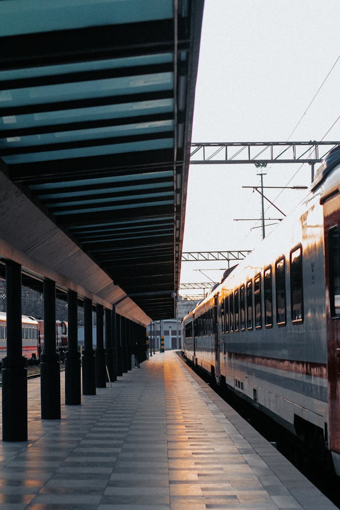 Serene evening view of a railway platform and passenger train in İzmir, Türkiye.